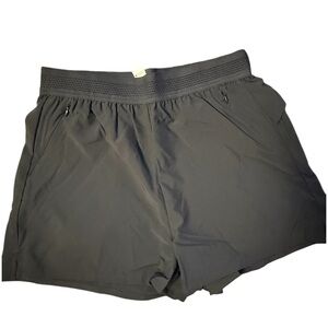 Halara breezeful shorts with ruffle back and zipper pockets small nwot